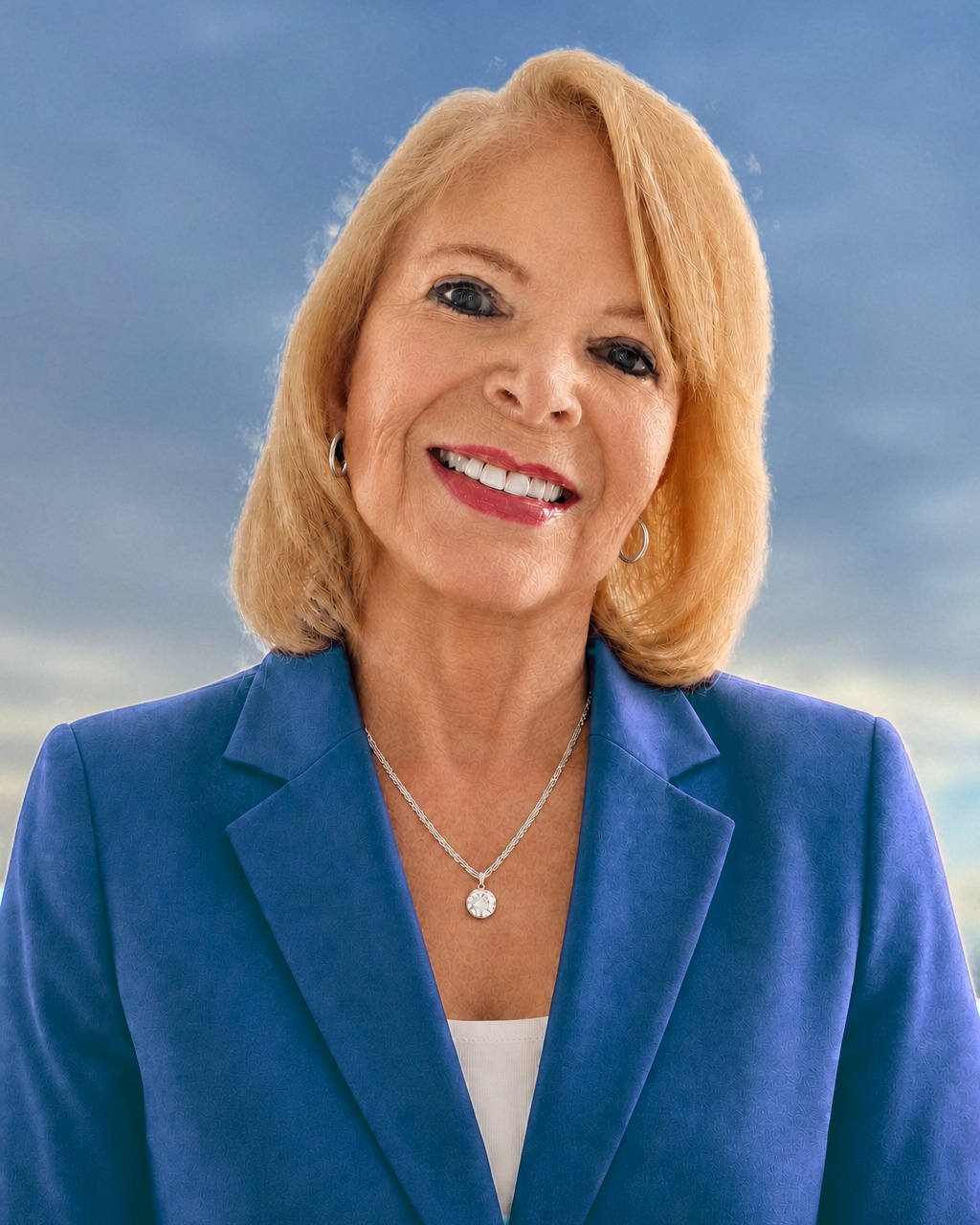 Dana Wallace Cash, smiling, a soft dawn sky behind her